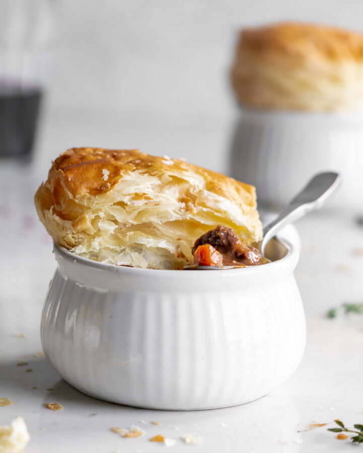 wine braised mushroom beef pie with puff pastry lids